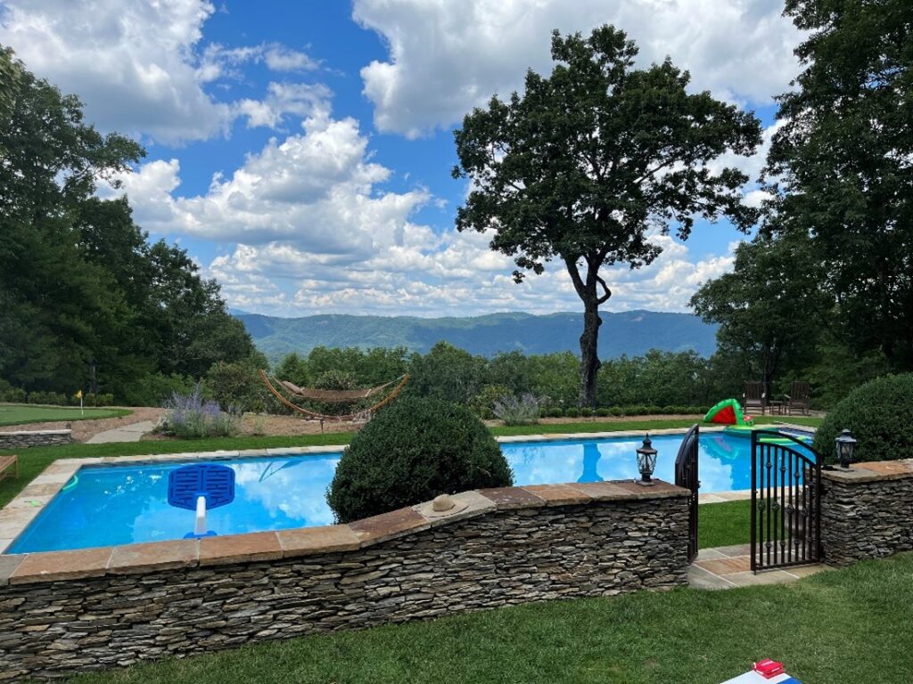 A backyard with a pool in the High Country with an excellent view because of our view enhancement services